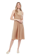Model wearing the Daphne Belize Satin Sleeveless Dress in Champagne, featuring a high crew neckline and flowy A-line silhouette, front view.