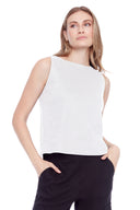 Model wearing the Lila Linen Sleeveless Top in White, front view.