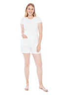 Model wearing the Elizabeth Solid Techno Pocket Short in White, featuring oversized front pockets, a pull-on waistband, and a flattering slim fit, front view.