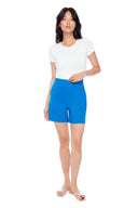 Model wearing the Isla Linen Short in lapis Blue, front view.