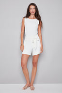 Model wearing the Victoria Vegan Silk Short in cream , featuring a removable tonal tie-front sash, side vents, and a flattering mid-rise fit, front view.