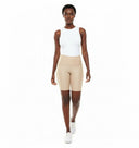 Model wearing the Vicky Waxed Biker Short in Stone, front view.