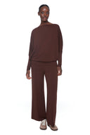 Model wearing the Sandy Provence Wide-Leg Full-Length Pant in Brown, featuring a relaxed wide-leg silhouette and exposed front seam detailing, front view.