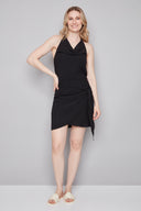 Model wearing the Poppy Air Flow Tie-Front Skirt in Black, featuring an asymmetric tie-front detail and slim silhouette, front view.