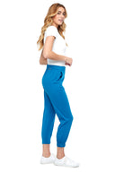 Model wearing the Shauna Light Ponte Jogger Pant in Sapphire blue , side view.