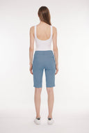 Model wearing the Dakota Bluestone Compression Bermuda Shorts, back view.