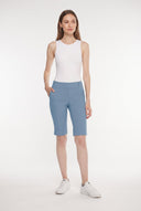 Model wearing the Dakota Bluestone Compression Bermuda Shorts, front view.
