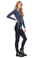 Model wearing the Vicky Faux Leather Pant in Black, side view.