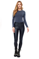 Model wearing the Vicky Faux Leather Pant in Black, front view.