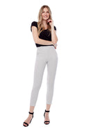 Model wearing the Gwyneth Stix Ankle Pant in Stix Black, front view.