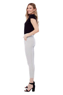 Model wearing the Gwyneth Stix Ankle Pant in Stix Black, side view.