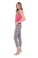Model wearing the Gwyneth Maze Techno Ankle Pant in Maze Print, side view.