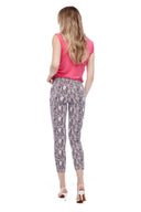 Model wearing the Gwyneth Maze Techno Ankle Pant in Maze Print, back view.