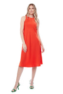 Model wearing the Daphne Belize Satin Sleeveless Dress in Papaya, featuring a high crew neckline and flowy A-line silhouette, front view.