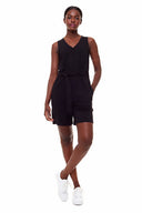 Model wearing the Kylie Light Ponte Belted Romper in black featuring a relaxed silhouette, self-tie belt, and deep V-neckline.
