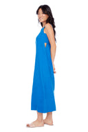 Model wearing the Charlie Lapis blue Linen Cutout Maxi Dress, side view.