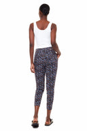 Back view of model wearing the Gwyneth Toulouse (French Floral) Ankle Pant showcasing the slim pull-on silhouette and floral pattern.