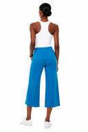 Model wearing the Carrie Light Ponte Wide-Leg Cropped Pant in Sapphire Blue, back view.