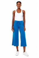 Model wearing the Carrie Light Ponte Wide-Leg Cropped Pant in Sapphire Blue, front view.
