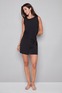 Model wearing the Victoria Vegan Silk Short in Black, featuring a removable tonal tie-front sash, side vents, and a flattering mid-rise fit, front view.