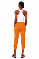 Model wearing the Keira Ruched Vegan Silk Jogger Pant in Marseille, back view.
