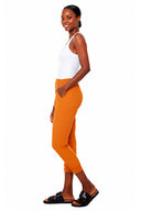 Model wearing the Keira Ruched Vegan Silk Jogger Pant in Mustard Marseille, side view.