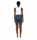 Model wearing the Vicky Waxed Biker Short in Navy, back view.