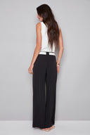 Back view of the Fiona Vegan Silk Belted Wide Leg Pant in Black, showcasing the relaxed fit and elegant full-length wide-leg design.