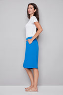 Side view of model wearing the Avery breeze Vegan Silk Bermuda Short, showcasing the tailored fit and below-the-knee length.
