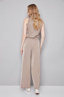 Back view of the Fiona Belize Satin Wide Leg Pant in Almond, showcasing the relaxed fit and elegant wide-leg design.