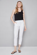 Model wearing the Chloe Techno Slim Ankle Pant in White, featuring a slim ankle silhouette and pull-on design, front view.