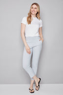 Model wearing the Chloe Blue Striped Techno Slim Ankle Pant in Blue Stripe, featuring a slim ankle silhouette and tailored striped design, front view.