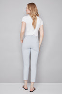 Model wearing the Chloe Blue Striped Techno Slim Ankle Pant in Blue Stripe, featuring a slim ankle silhouette and tailored striped design, back view.