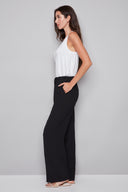 Side view of the Fiona Air Flow Wide Leg Pant in Black, showcasing the lightweight wide-leg design and relaxed fit.