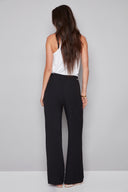 Back view of the Fiona Air Flow Wide Leg Pant in Black, showcasing the lightweight wide-leg design and relaxed fit.