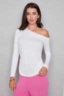 Model wearing the Claude Provence Drop-Shoulder Top in White, featuring an asymmetrical one-shoulder neckline, long sleeves, and subtle ruching, front view.
