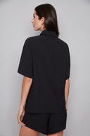 Back view of the Presley black Air Flow Button-Down Top, highlighting the clean tailoring and easy, effortless fit.