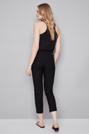 Model wearing the Chloe Techno Slim Ankle Pant in Black, featuring a slim ankle silhouette and pull-on design, back view.
