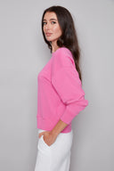 Side view of model wearing the Alessia Provence Sweatshirt, showcasing the easy silhouette and cozy fit.