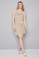 Model wearing the Poppy Air Flow Tie-Front Skirt in Cashew, featuring an asymmetric tie-front detail and slim silhouette, front view.