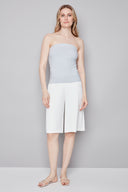 Model wearing the Bryana Blue Striped Techno Tube Top in Blue Stripe, featuring a structured strapless silhouette and subtle boning, front view.