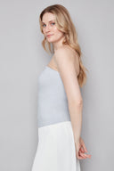 Model wearing the Bryana Blue Striped Techno Tube Top in Blue Stripe, featuring a structured strapless silhouette and subtle boning, side view.