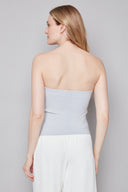 Model wearing the Bryana Blue Striped Techno Tube Top in Blue Stripe, featuring a structured strapless silhouette and subtle boning, back view.