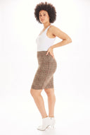 Model wearing the Margot Plaid Faux Suede Skirt in Dundee Plaid, side view.