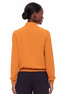 Woman wearing Kamala Vegan Silk Bomber Jacket in Marseille, back view.
