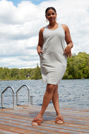 Front view of model wearing the Zandaya French Terry Tank Dress in light grey melange with a sleeveless tank silhouette, scoop neckline, and side pockets.