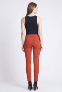 Model wearing the Peyton Burnt Orange Twill Pant with animal side tape detail, back view