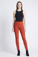 Model wearing the Peyton Burnt Orange Twill Pant with animal side tape detail, front view