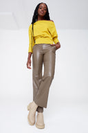 Model wearing the Yaelle Faux Leather Ankle Pant in Taupe, front view.